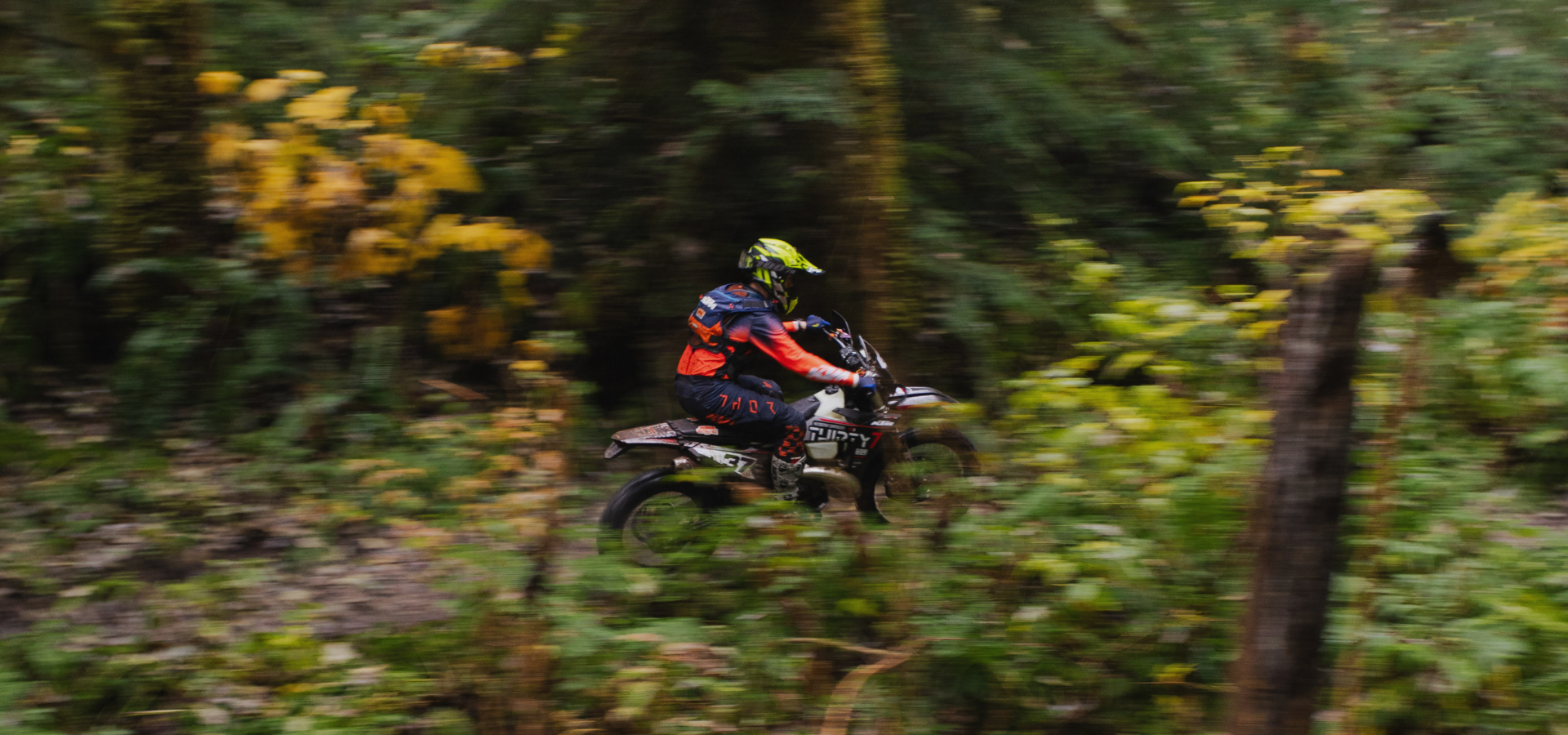 dirtbike riding in squamish showing thirty 7 tools stickers